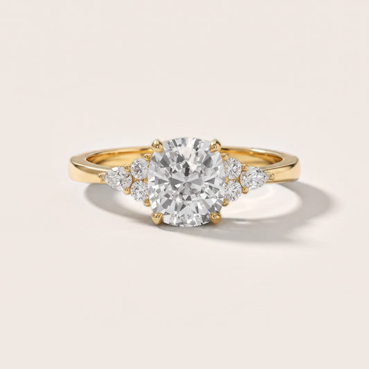 Amelia Three Stone Cushion Diamond Engagement Ring in Yellow Gold