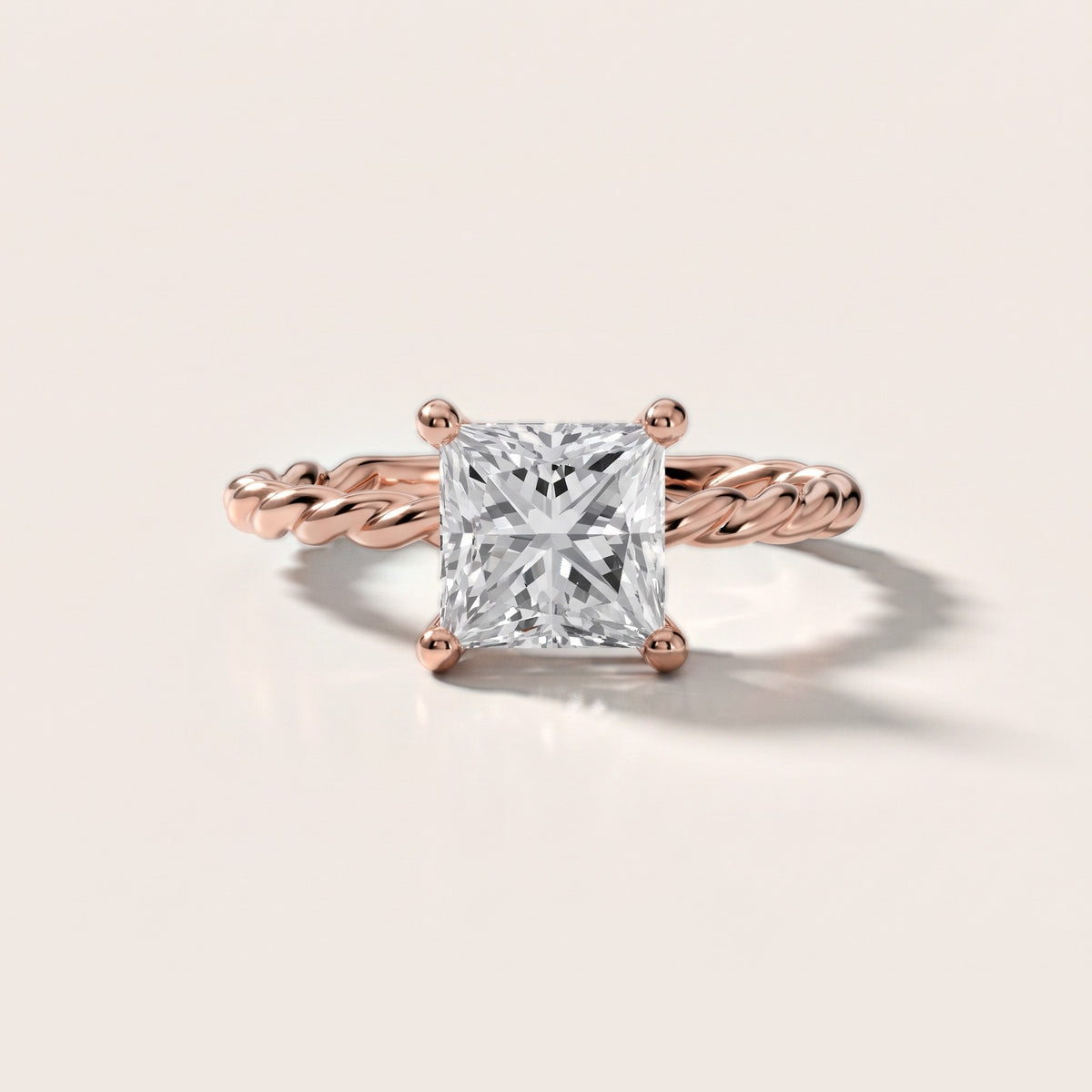 Robyn Twist Solitaire Princess Diamond Engagement Ring in Rose Gold - front.jpg