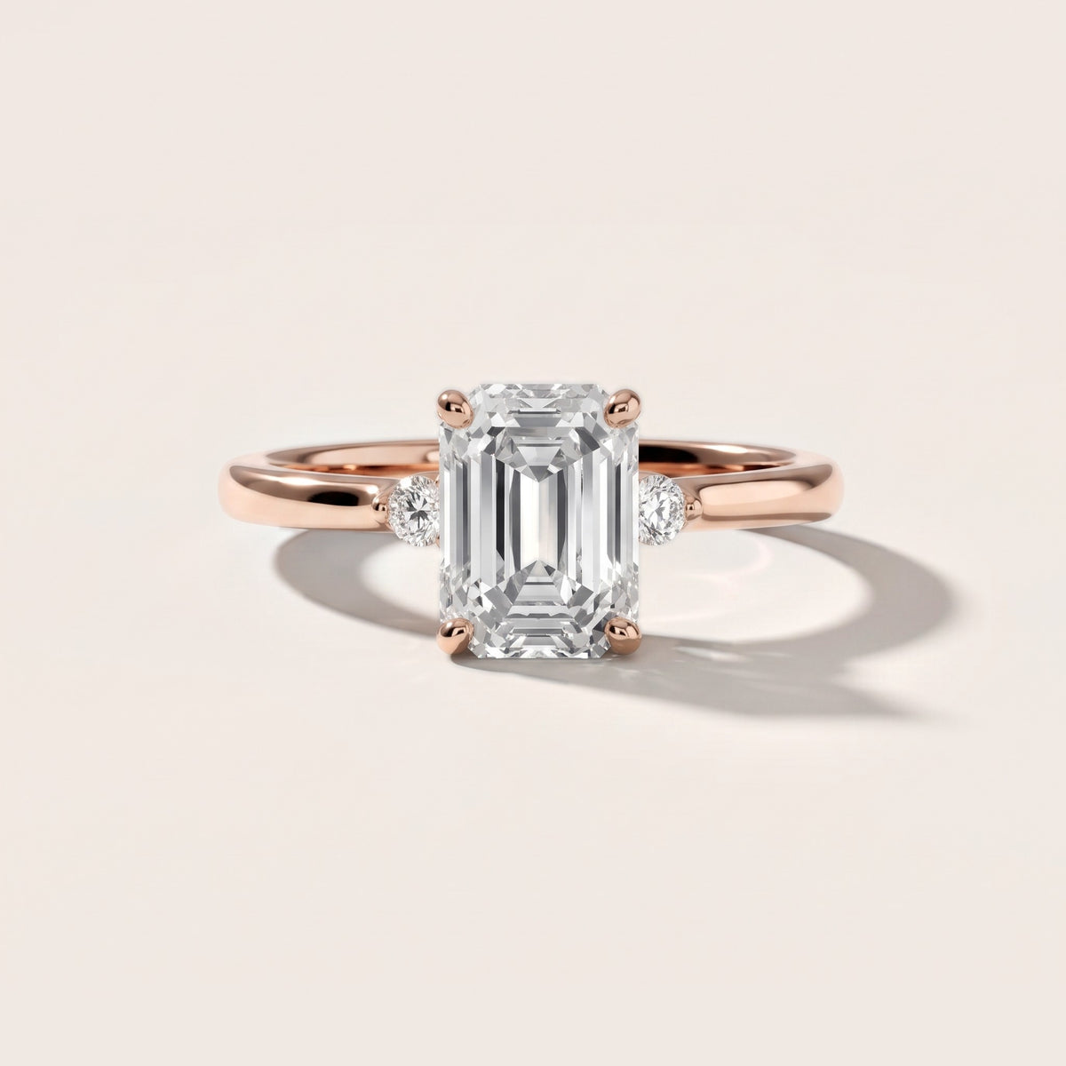 Teodora Floating Three-Stone Emerald Diamond Engagement Ring in Rose Gold - front.jpg