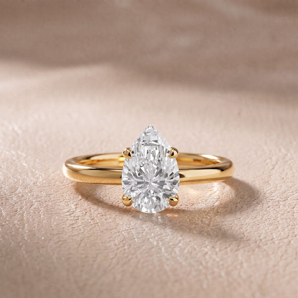 Charlotte Charm Solitaire Pear Diamond Engagement Ring in Yellow Gold