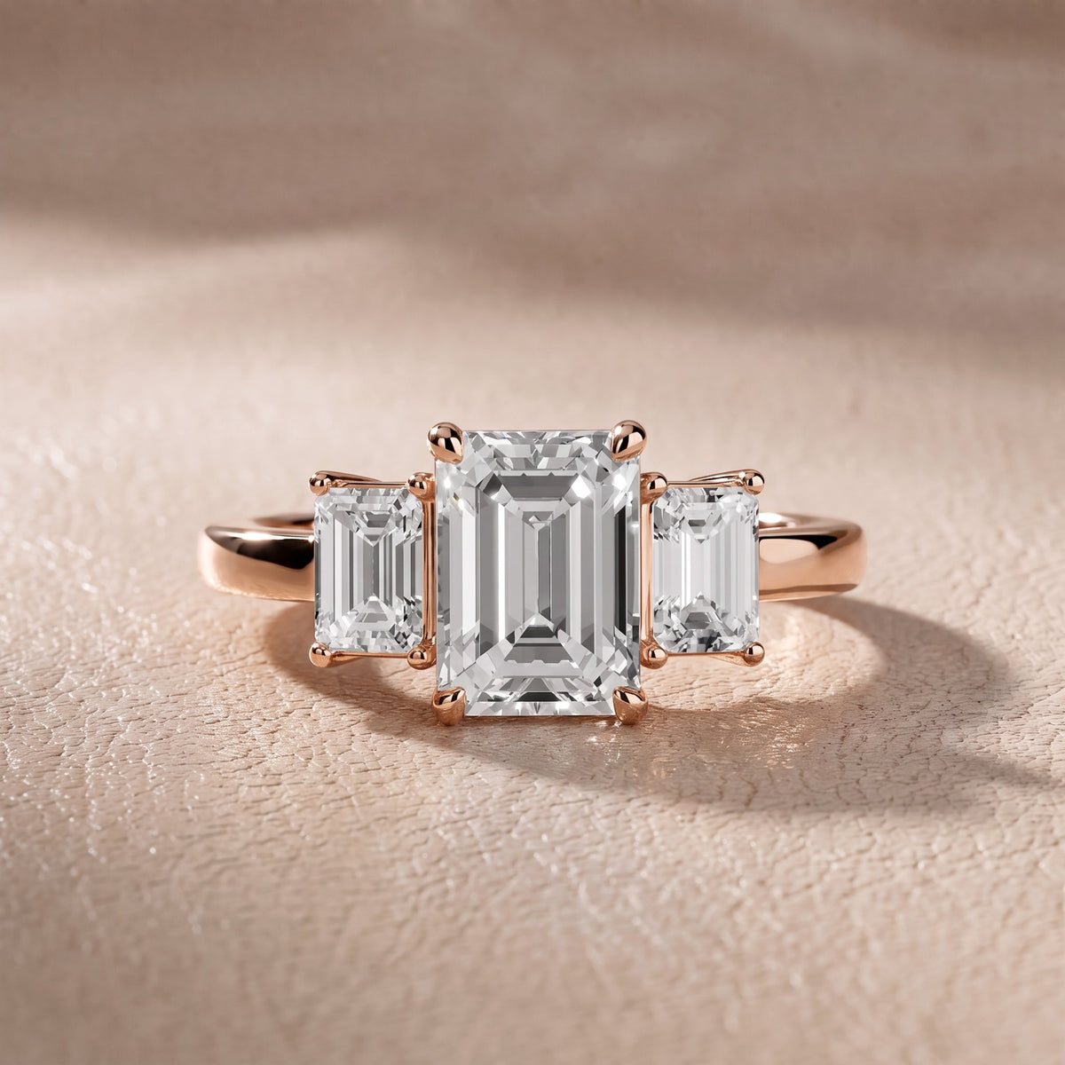 Zoe Three-Stone Emerald Diamond Engagement Ring in Rose Gold - front.jpg