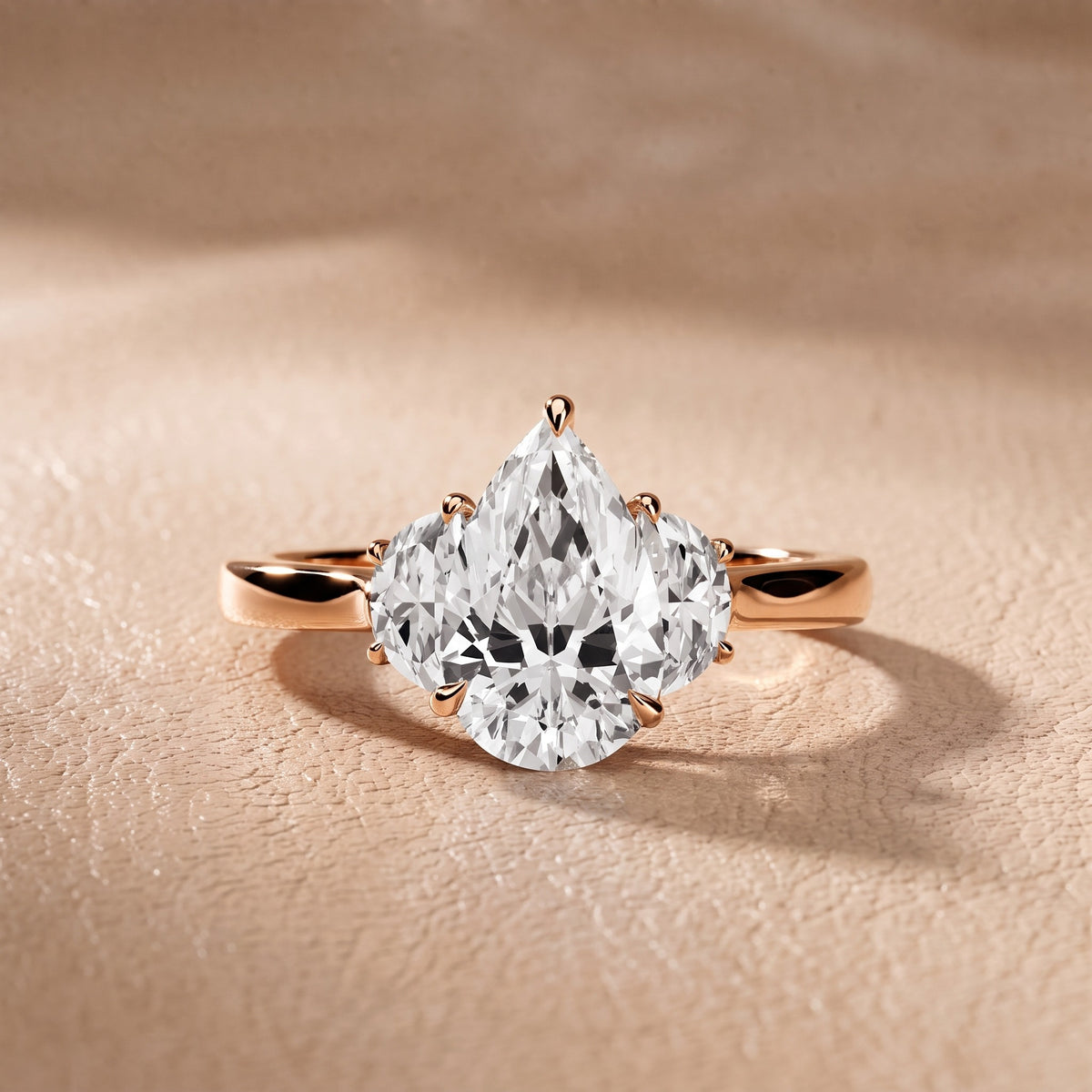 Romy Three-Stone Pear Diamond Engagement Ring in Rose Gold - front.jpg