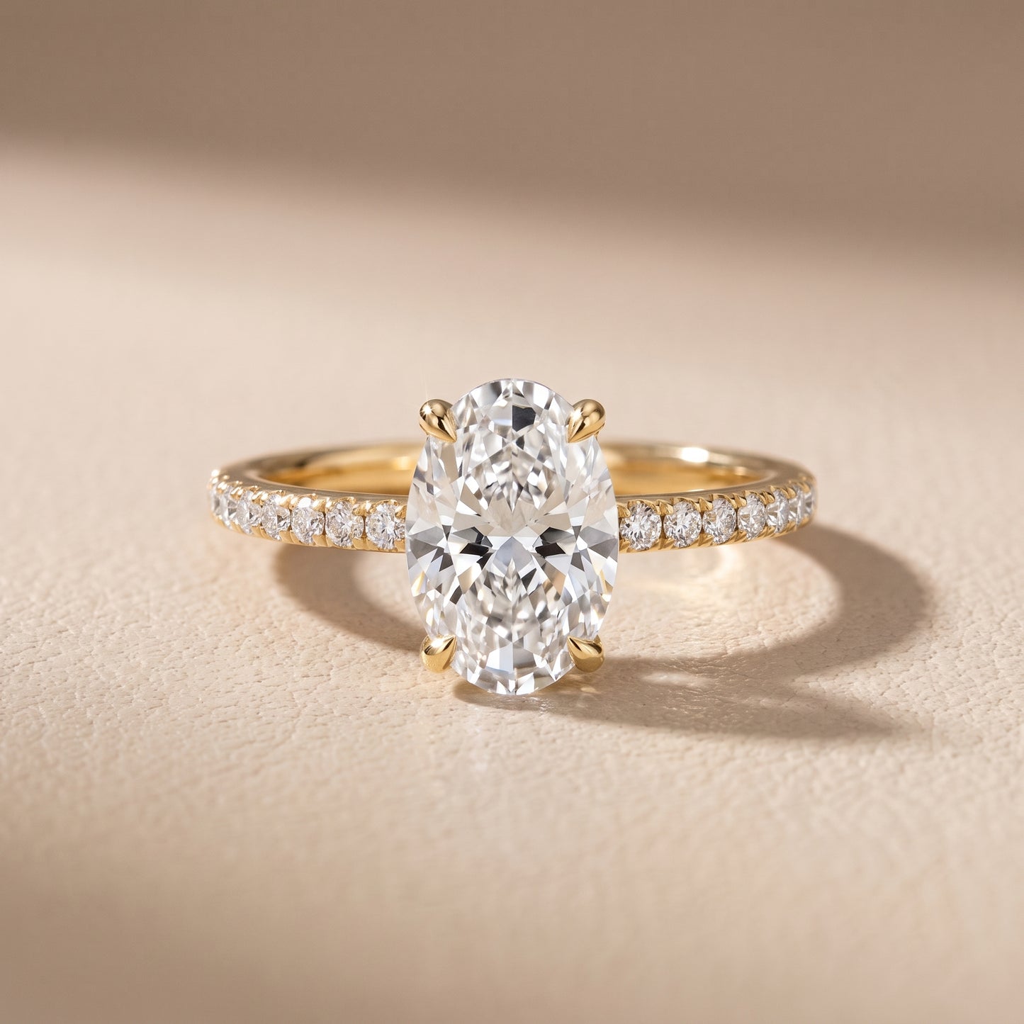 Ione Solitaire Pavé Oval Diamond Engagement Ring in Yellow Gold - front.jpg