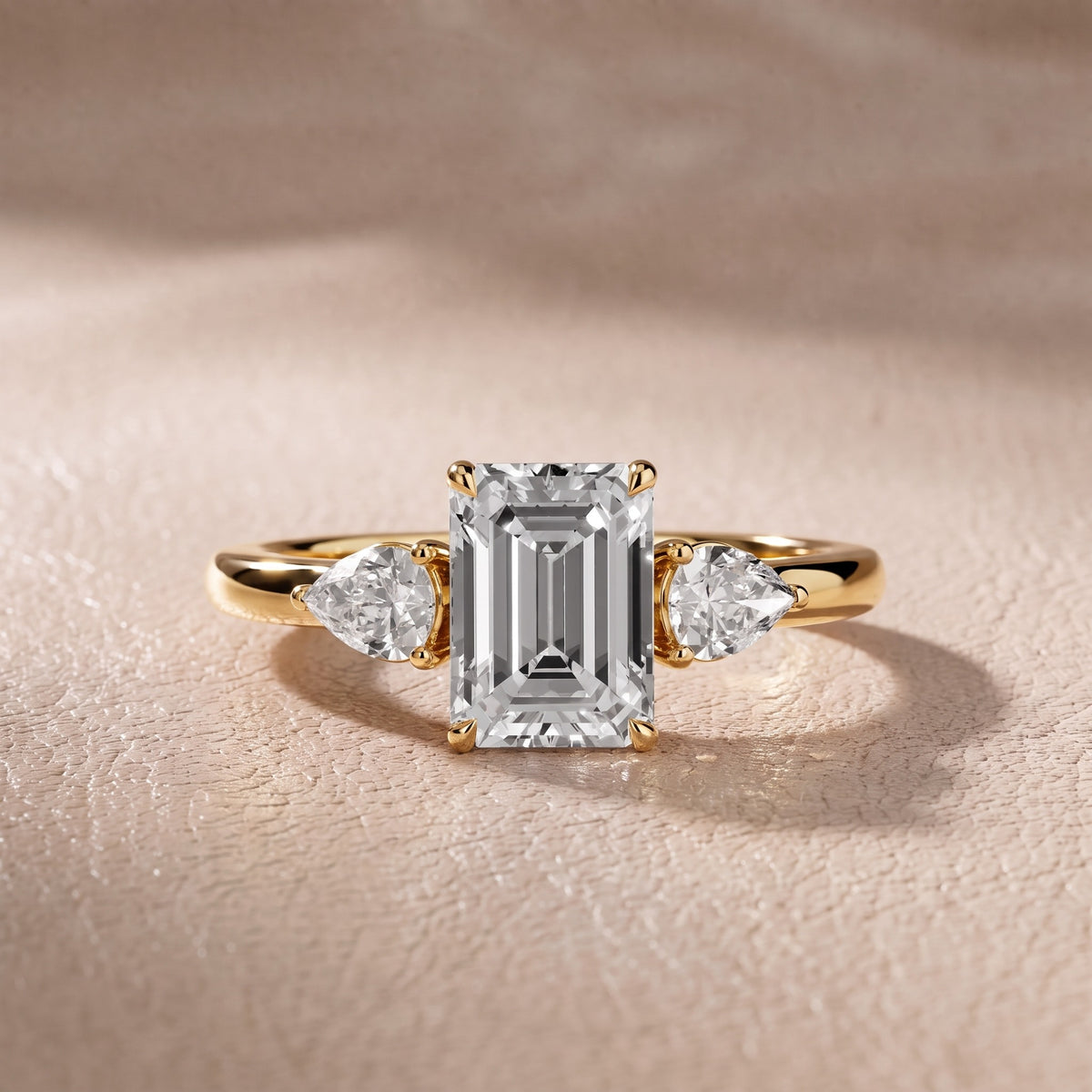 Stella Three-Stone Emerald Diamond Engagement Ring in Yellow Gold - front.jpg
