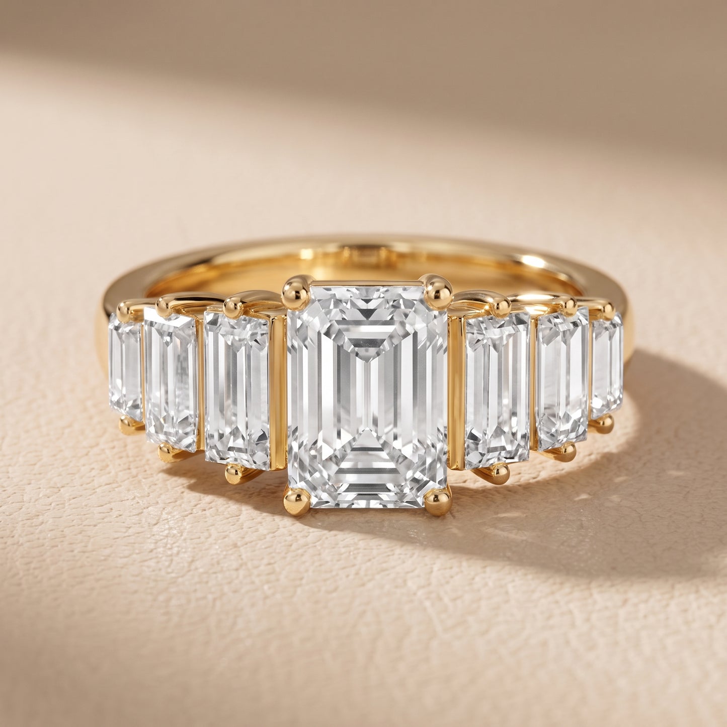Mara Sidestone Baguette Accent Emerald Diamond Engagement Ring in Yellow Gold - front.jpg