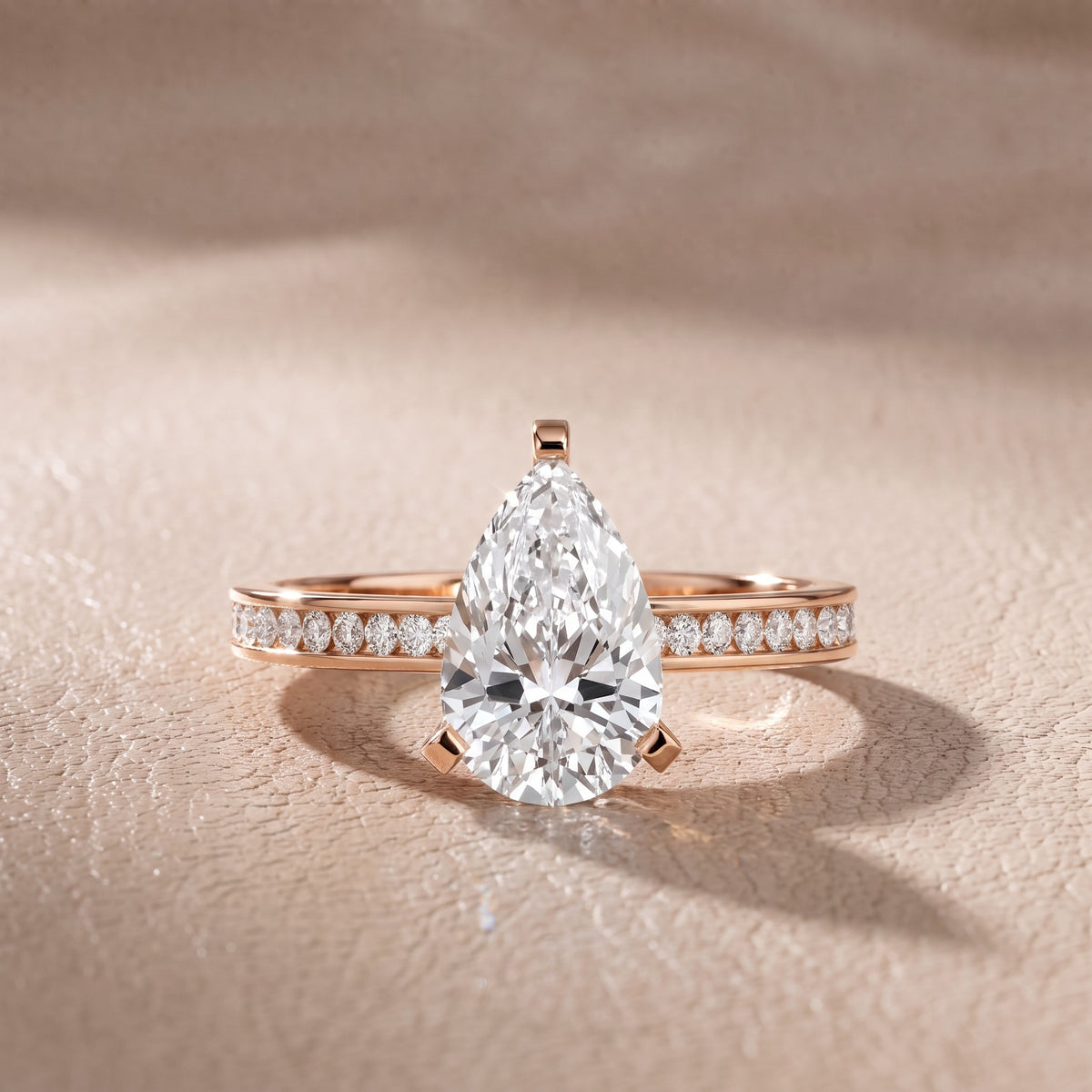 Tessa Solitaire Channel Set Pear Diamond Engagement Ring in Rose Gold - front.jpg