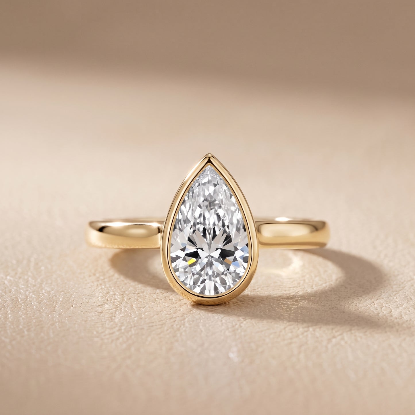 Jolie Bezel Solitaire Pear Diamond Engagement Ring in Yellow Gold - front.jpg