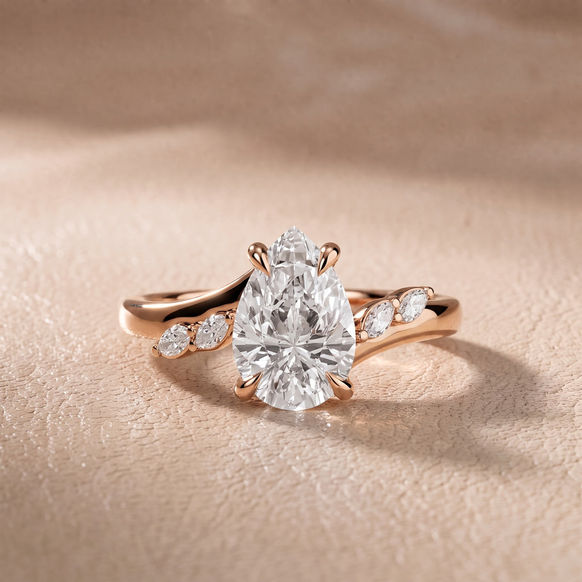 Flora Twist Side Stone Pear Diamond Engagement Ring in Rose Gold - front.jpg