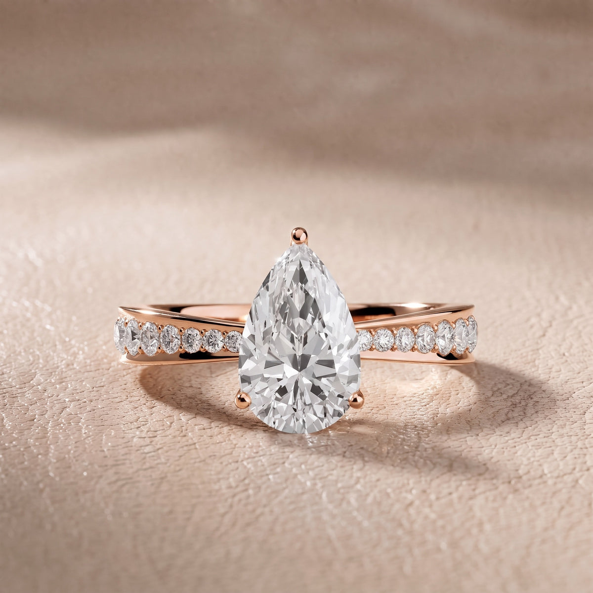 Rhea Sidestone Pavé Pear Diamond Engagement Ring in Rose Gold - front.jpg
