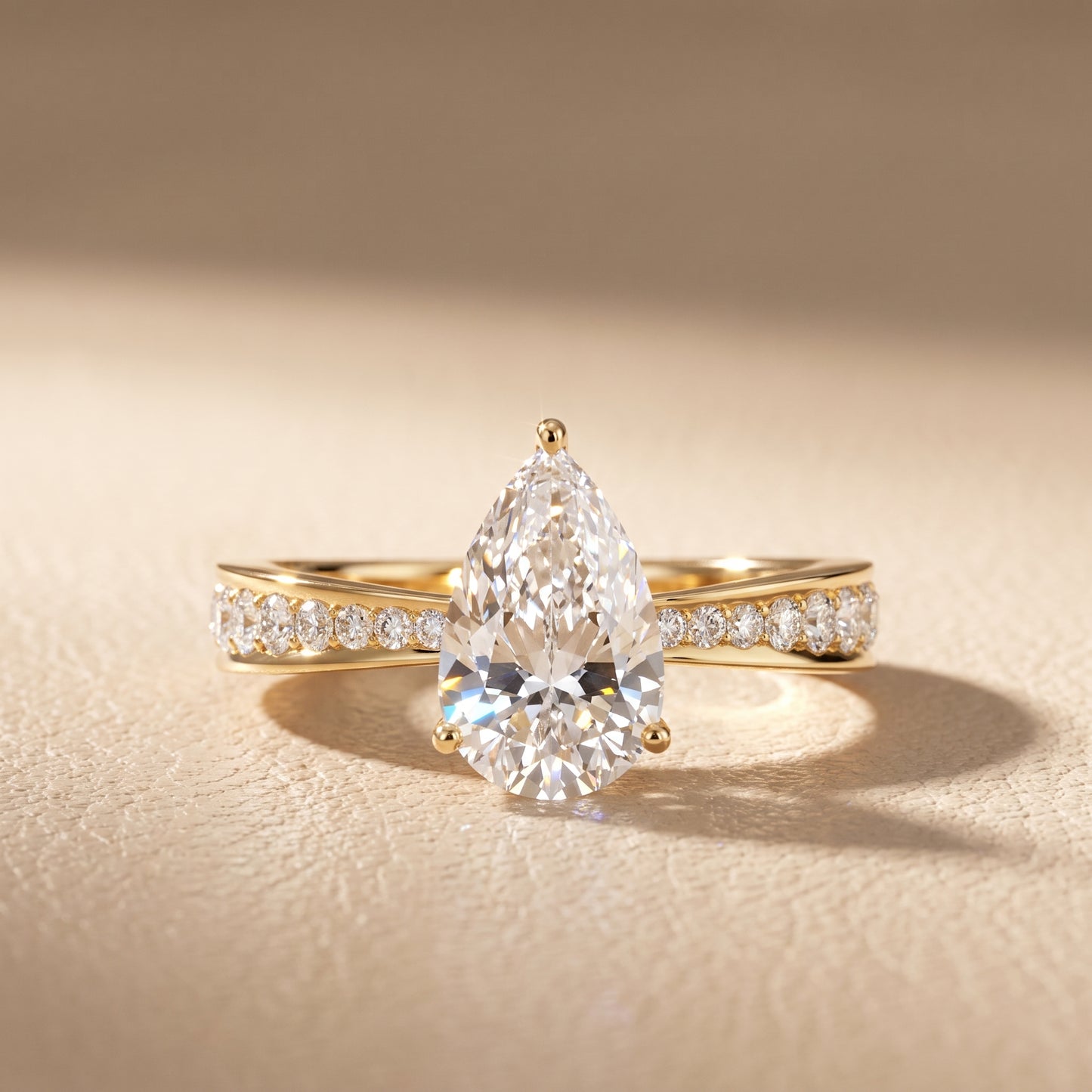 Rhea Sidestone Pavé Pear Diamond Engagement Ring in Yellow Gold - front.jpg