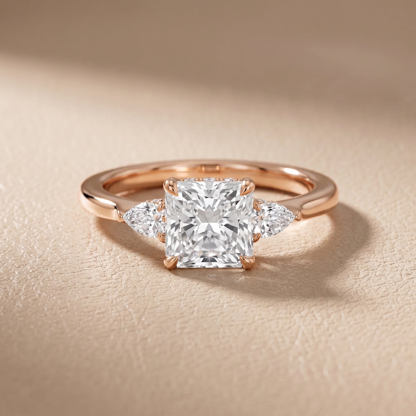 Leila Three-Stone Radiant Diamond Engagement Ring in Rose Gold - front.jpg
