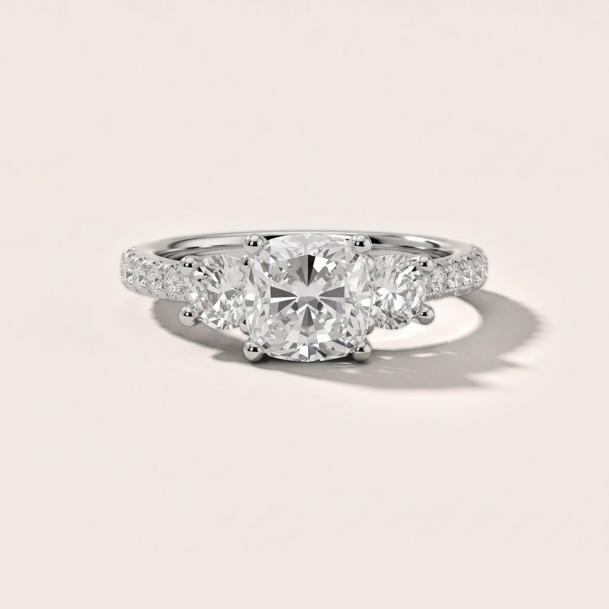 Sibyl Trellis Three-Stone Cushion Diamond Engagement Ring in Platinum - front.jpg
