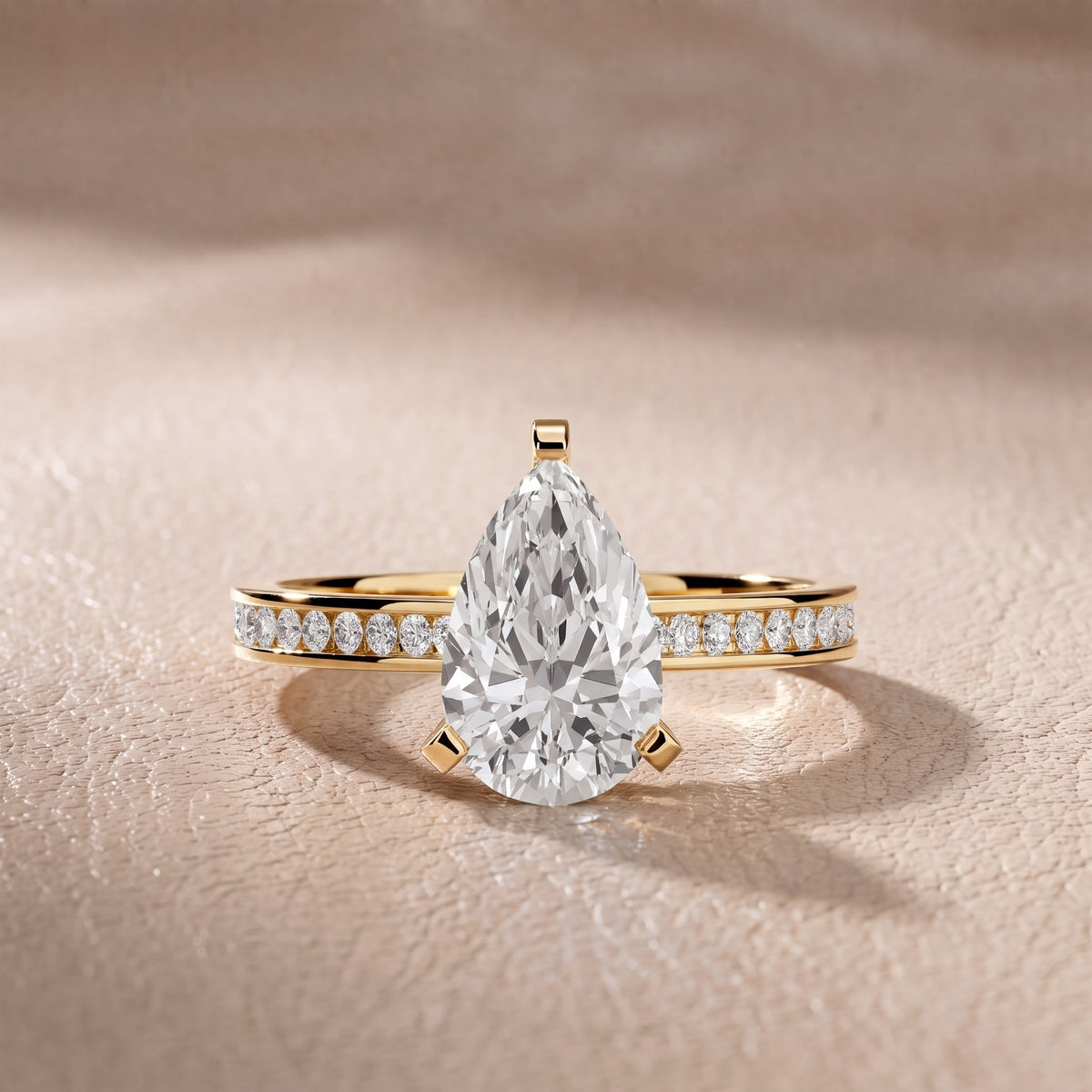 Tessa Solitaire Channel Set Pear Diamond Engagement Ring in Yellow Gold - front.jpg