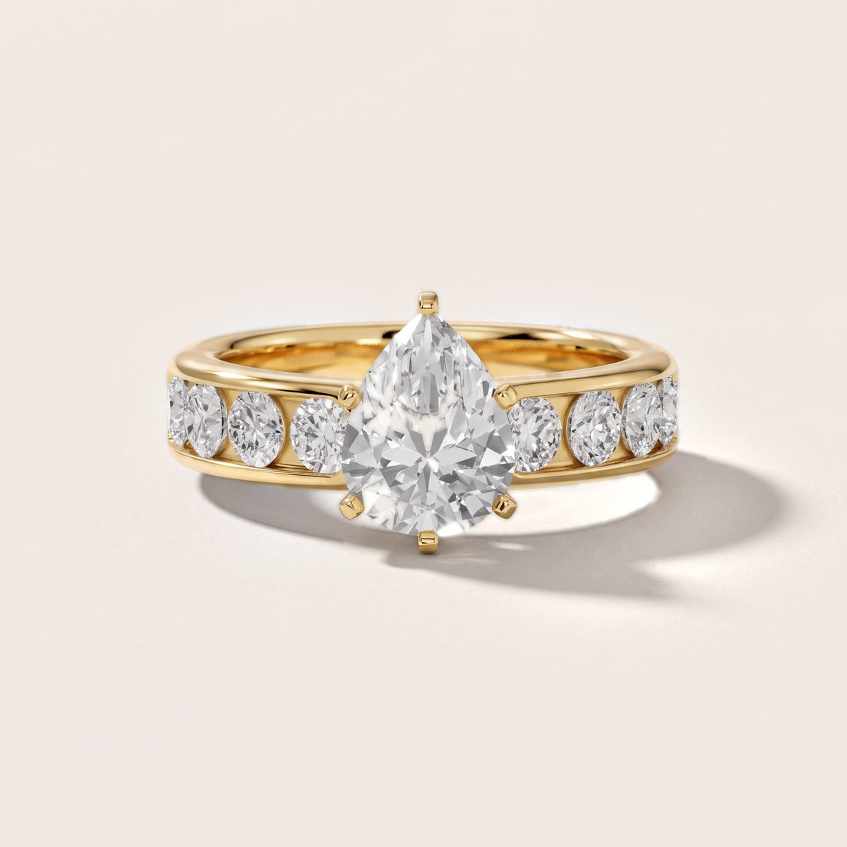 Sedona Wide Band Channel Set Pear Diamond Engagement Ring in Yellow Gold - front.jpg