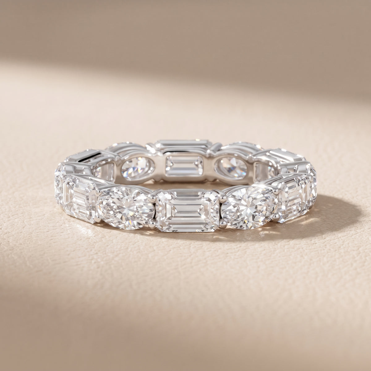Avery Shared Prong Emerald & Oval Diamond Eternity Band in White Gold - front.jpg
