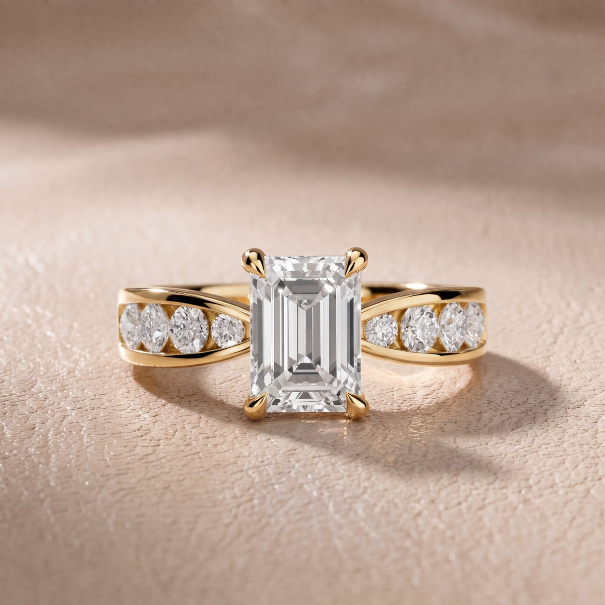 Rosalie Channel Set Sidestone Emerald Diamond Engagement Ring in Yellow Gold - front.jpg