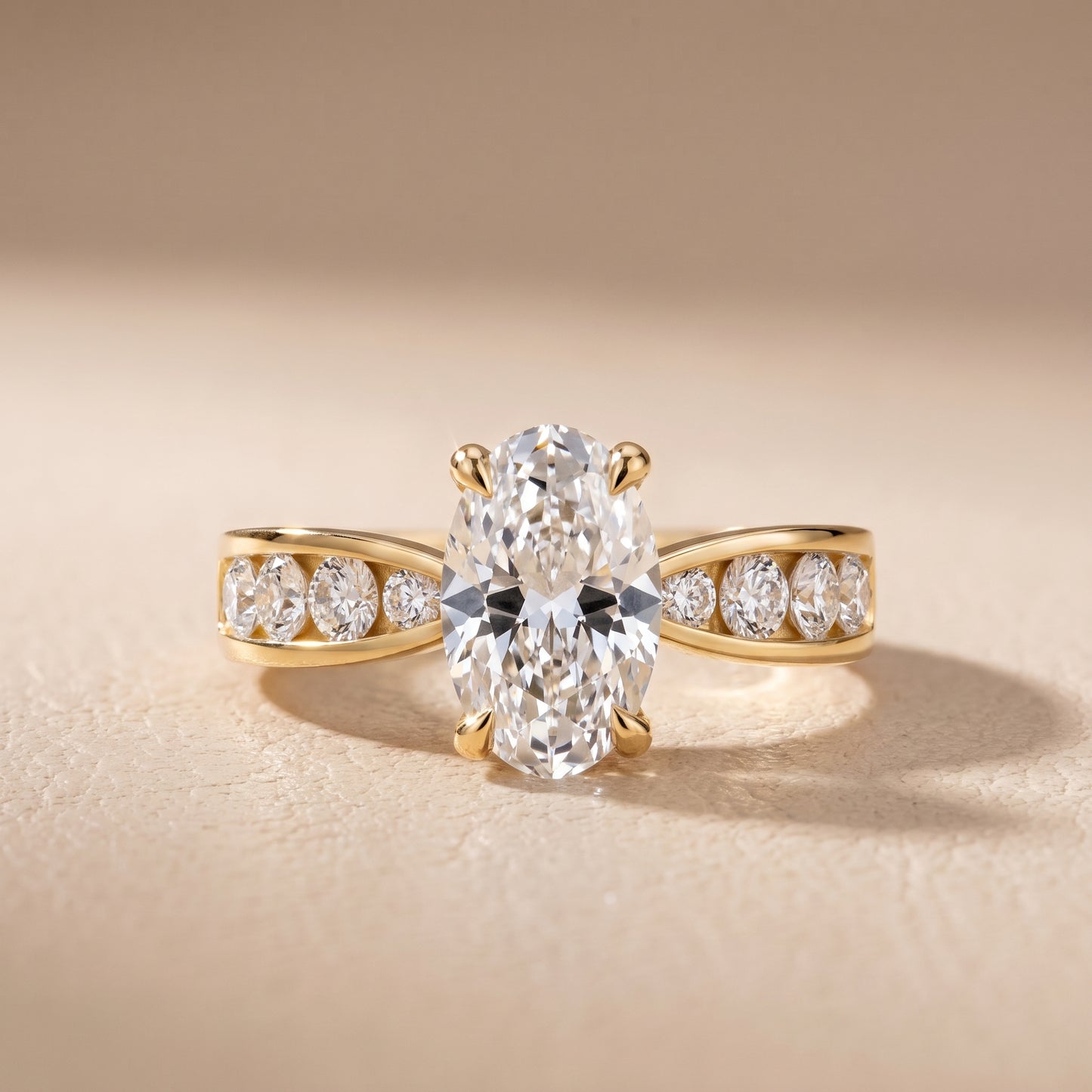 Noor Channel Set Sidestone Oval Diamond Engagement Ring in Yellow Gold - front.jpg
