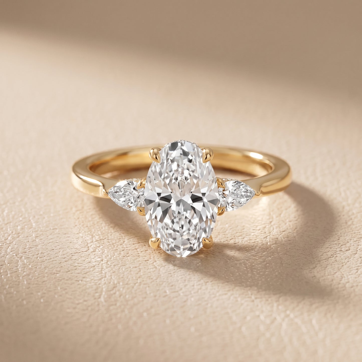 Leila Three-Stone Oval Diamond Engagement Ring in Yellow Gold - front.jpg