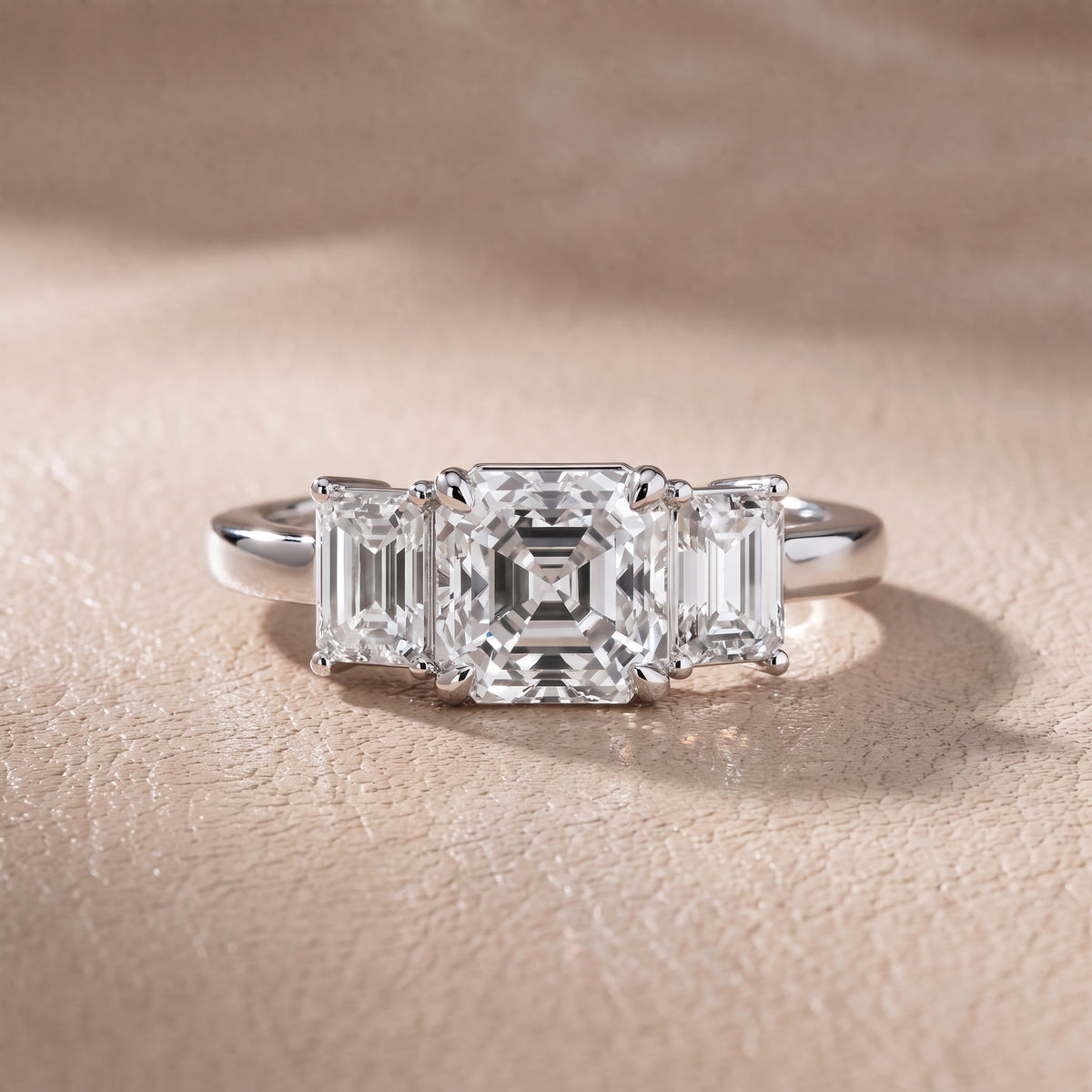 Zoe Three-Stone Asscher Diamond Engagement Ring in Platinum - front.jpg