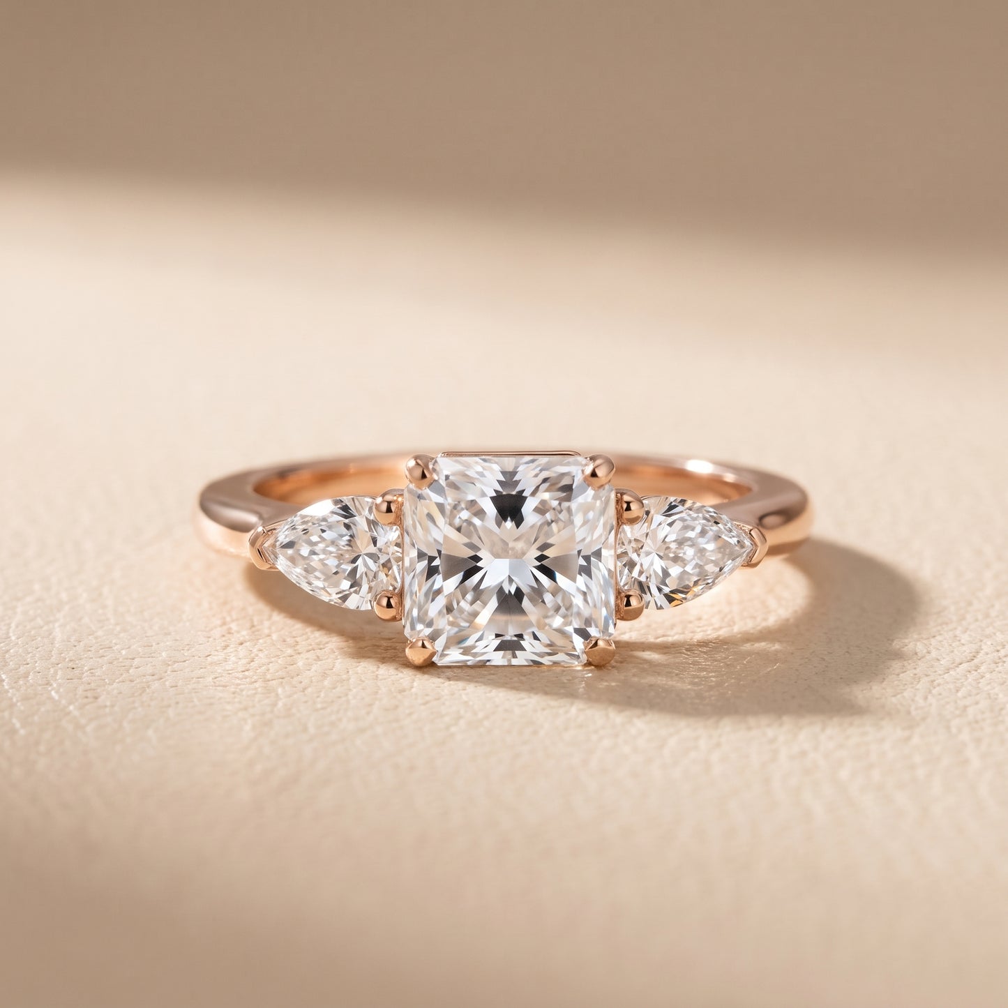 Mirabel Three-Stone Radiant Diamond Engagement Ring in Rose Gold - front.jpg