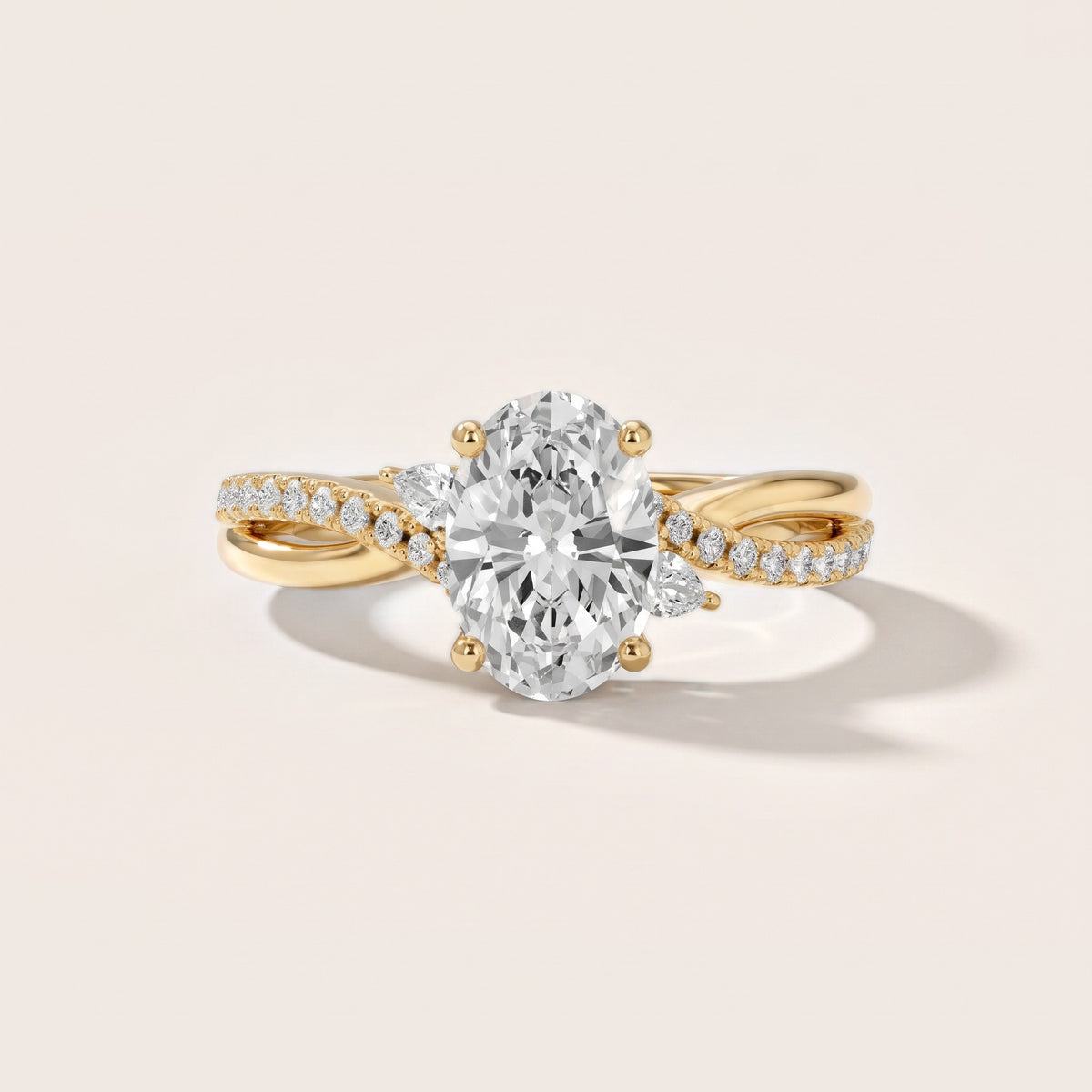 Reno Pear-Side Twist Oval Diamond Engagement Ring in Yellow Gold - front.jpg
