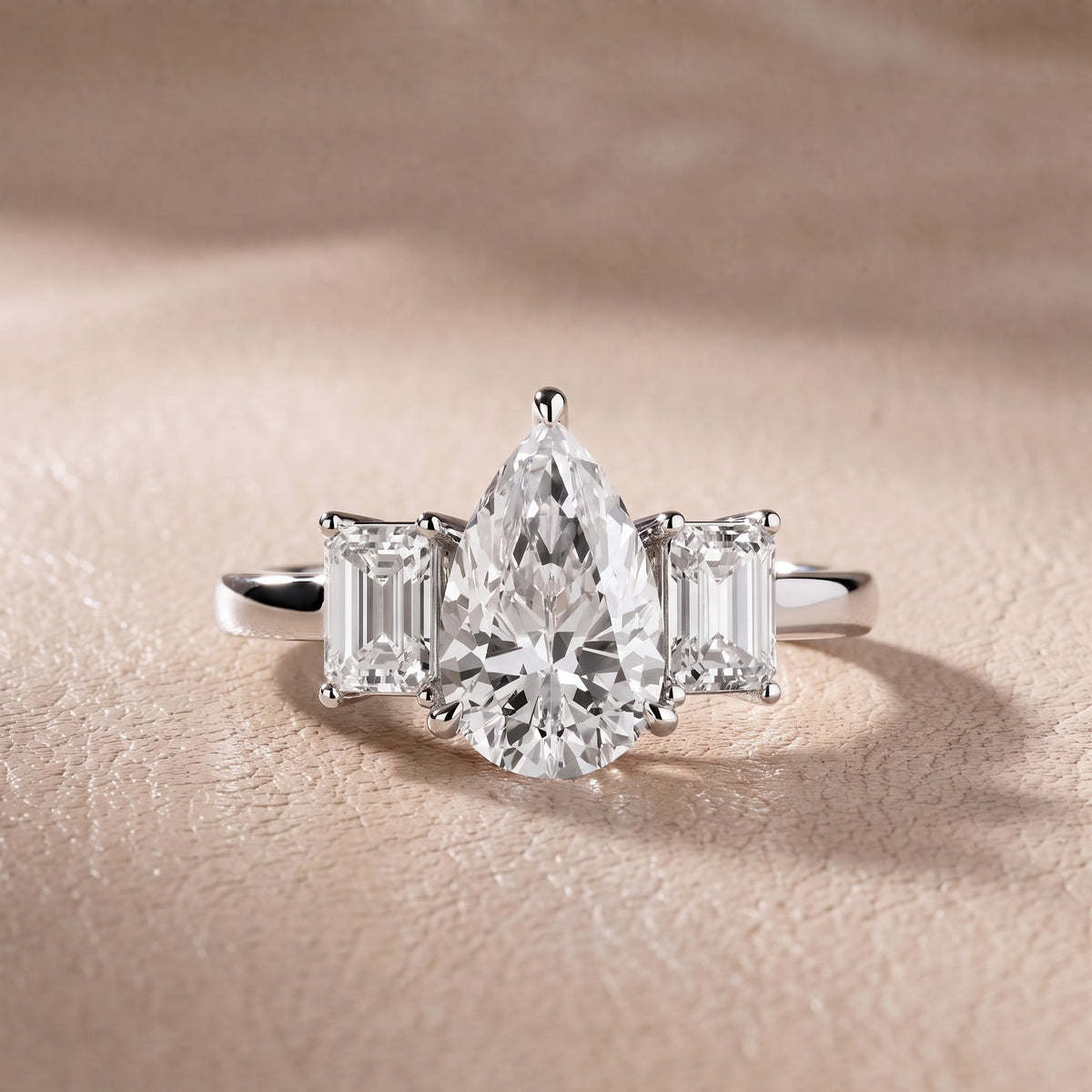 Zoe Three-Stone Pear Diamond Engagement Ring in Silver - front.jpg