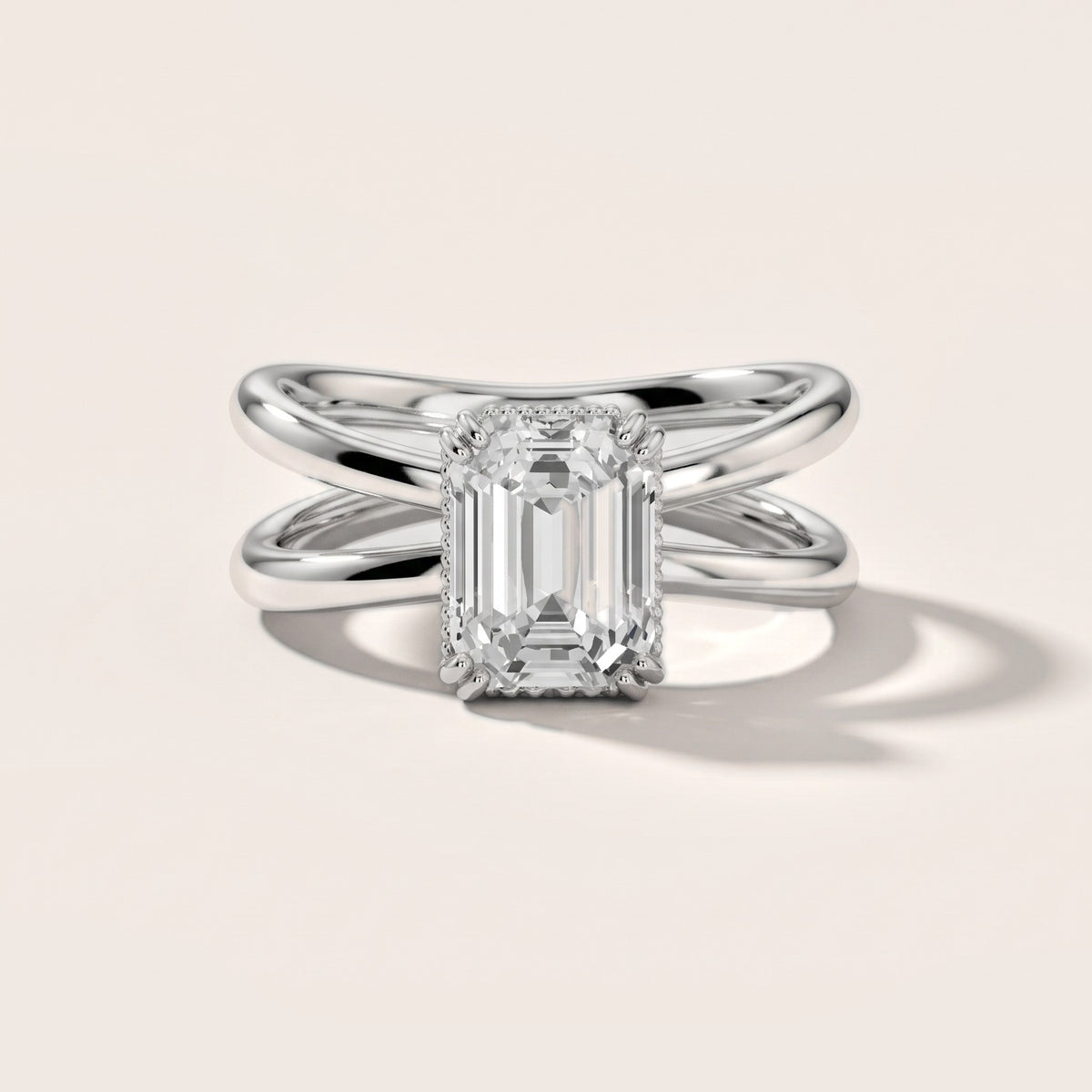 Yvonne Crossover Solitaire Emerald Diamond Engagement Ring in Platinum - front.jpg