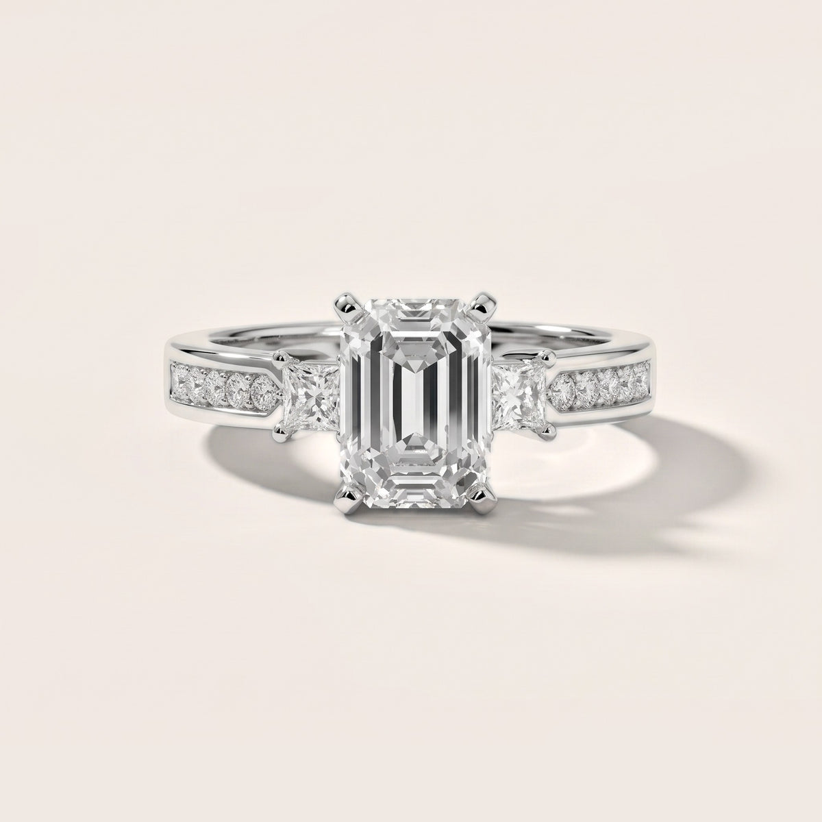 Ilona Three-Stone Channel Set Emerald Diamond Engagement Ring in White Gold - front.jpg