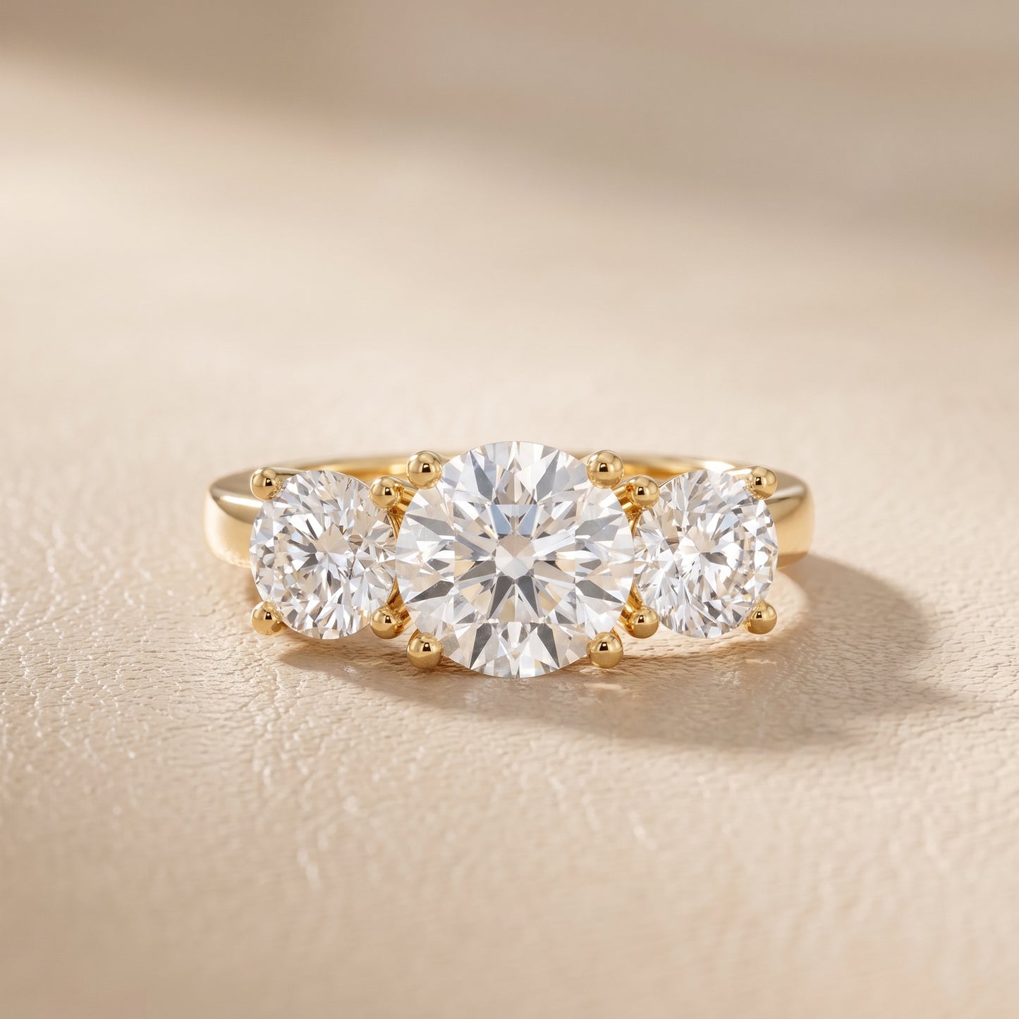 Callie Three-Stone Trellis Round Diamond Engagement Ring in Yellow Gold - front.jpg