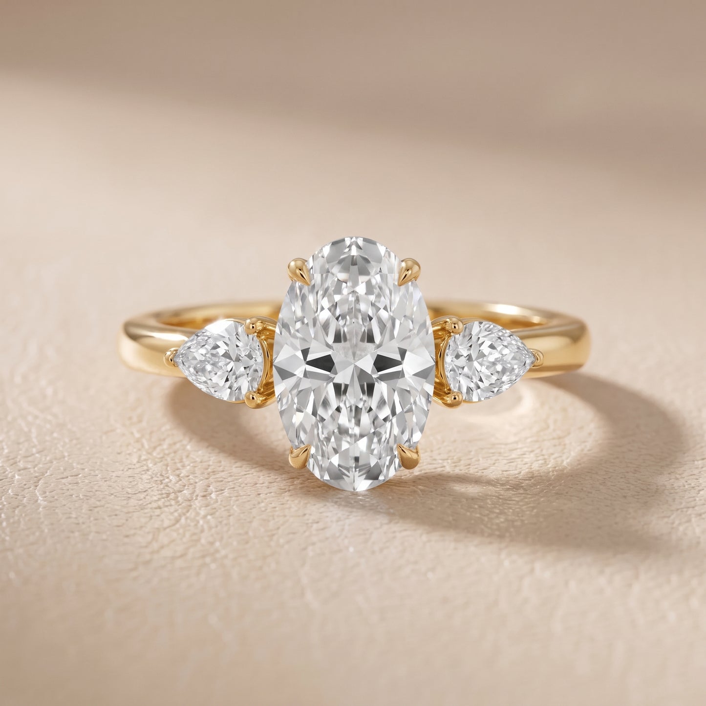 Phoebe Three-Stone Oval Diamond Ring in Yellow Gold - front.jpg