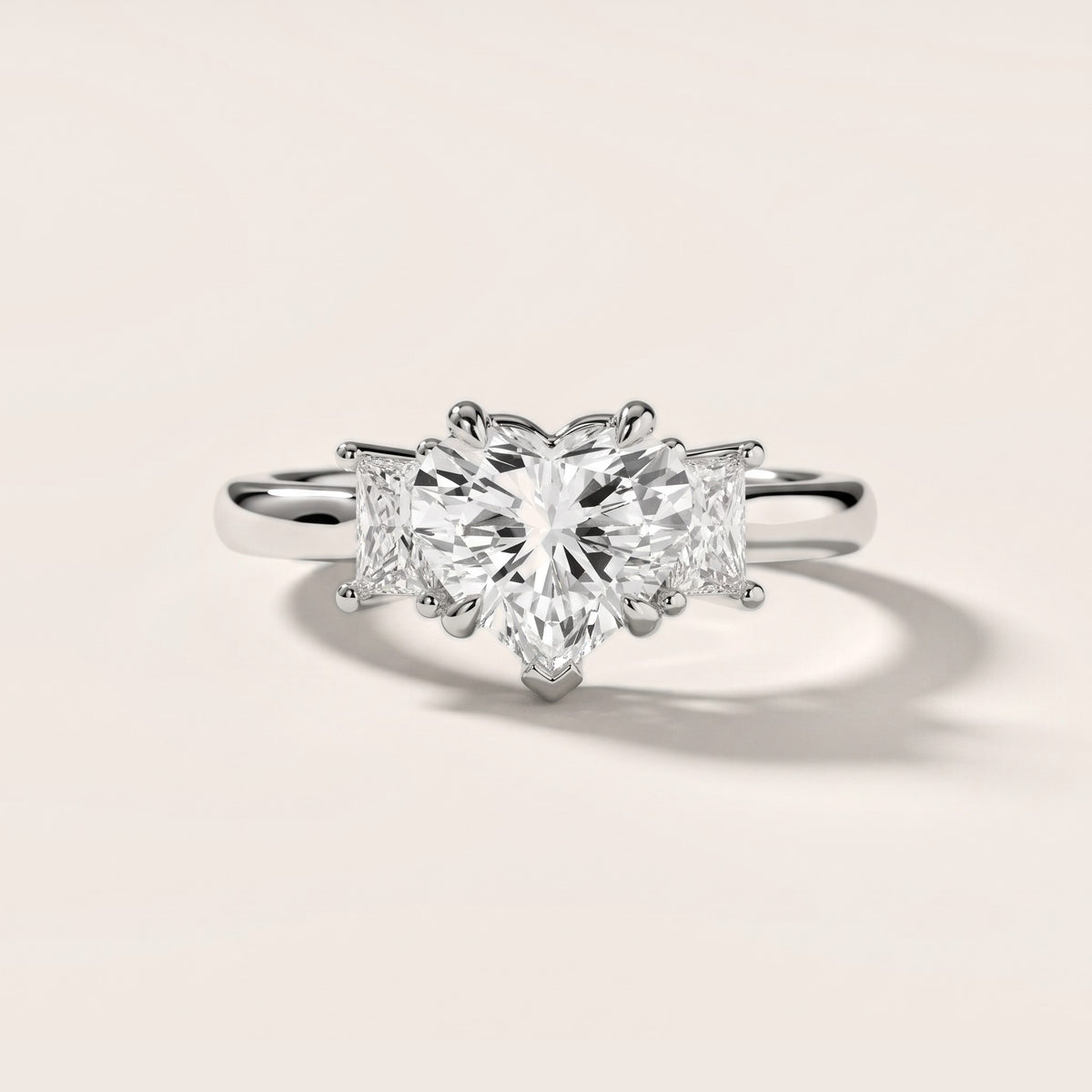 Cosette Statement Three-Stone Heart Diamond Engagement Ring in Platinum - front.jpg