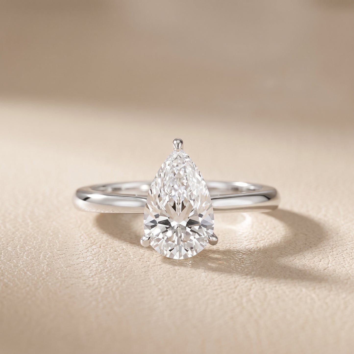 Kalia Knife Edge Solitaire Pear Diamond Engagement Ring in Platinum - front.jpg