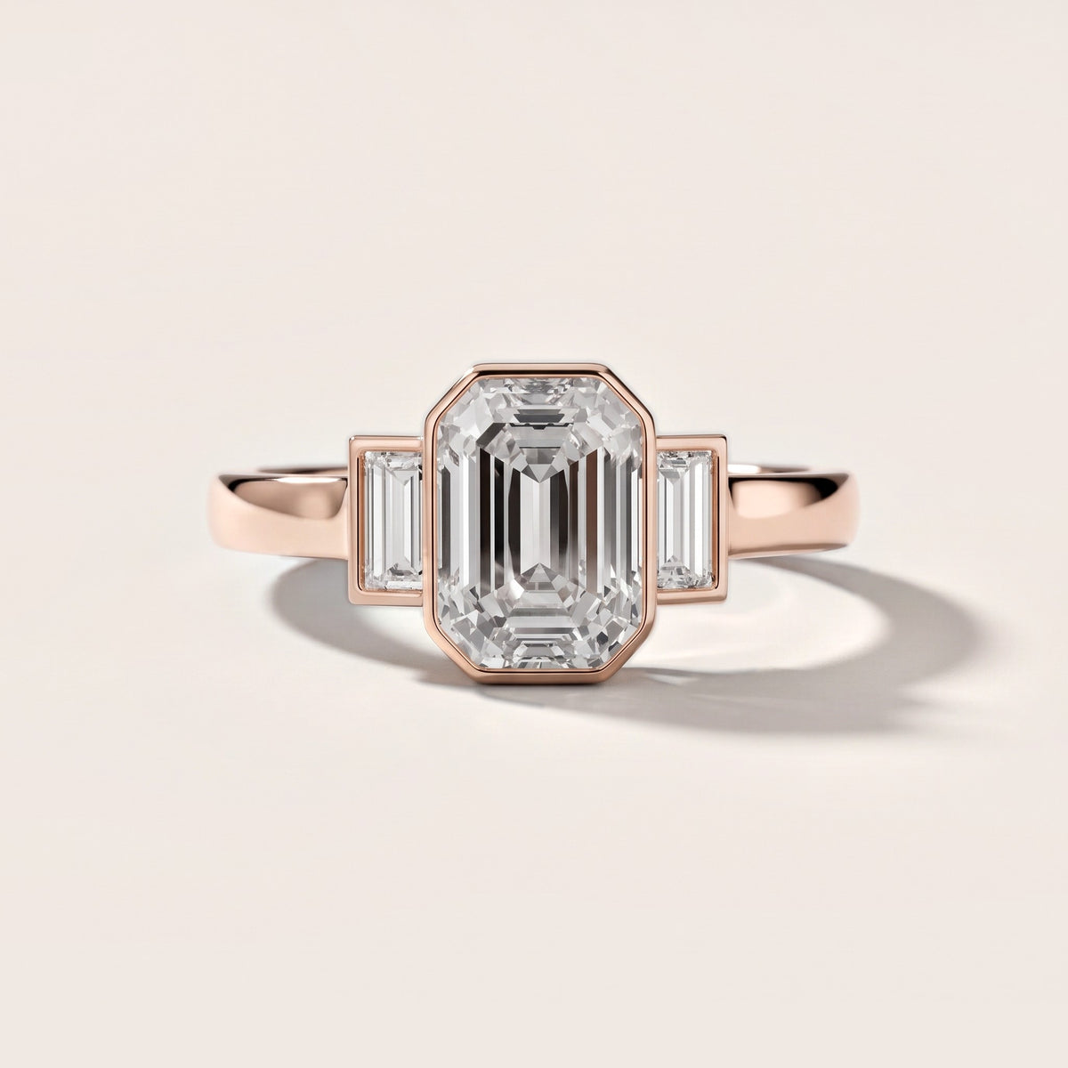 Paia Bezel Three-Stone Emerald Diamond Engagement Ring in Rose Gold - front.jpg