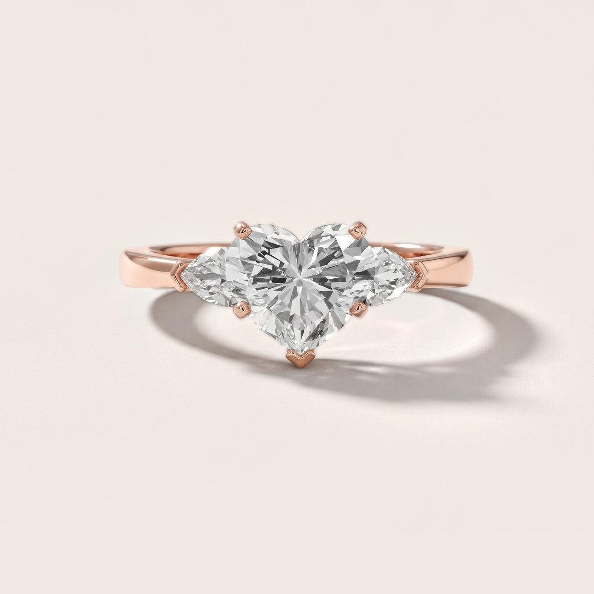 Amabel Three-Stone Heart Diamond Engagement Ring in Rose Gold - front.jpg
