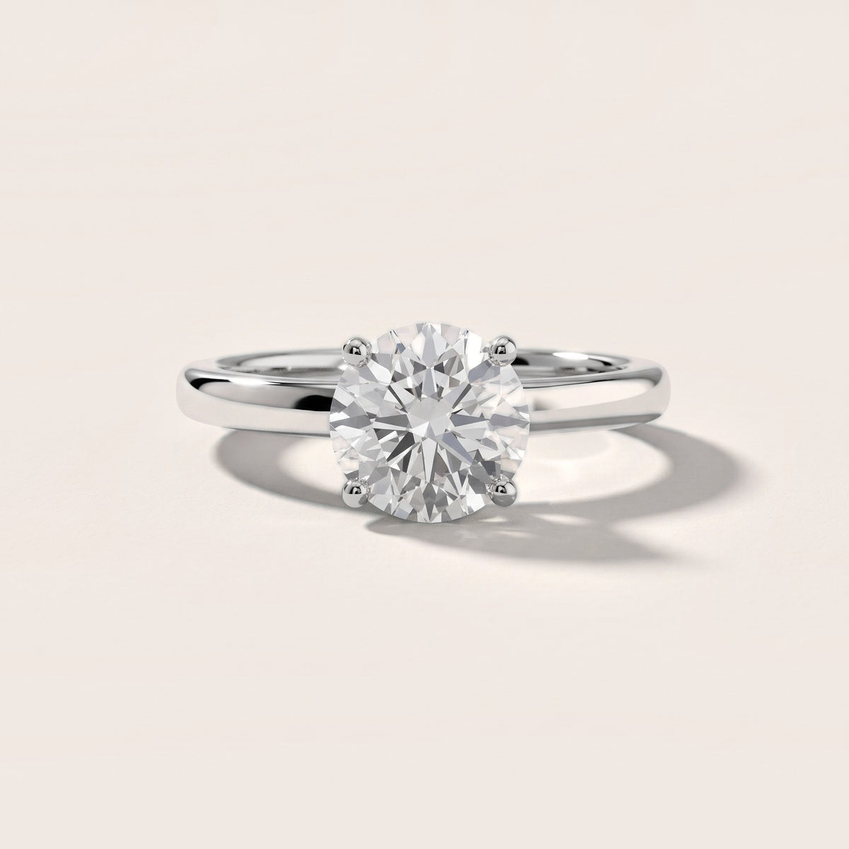 Emeline Solitaire Cathedral Round Diamond Engagement Ring in Platinum - front.jpg