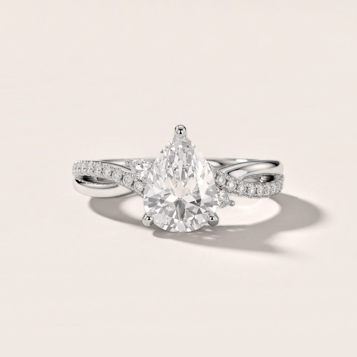Reno Pear-Side Twist Pear Diamond Engagement Ring in Platinum - front.jpg