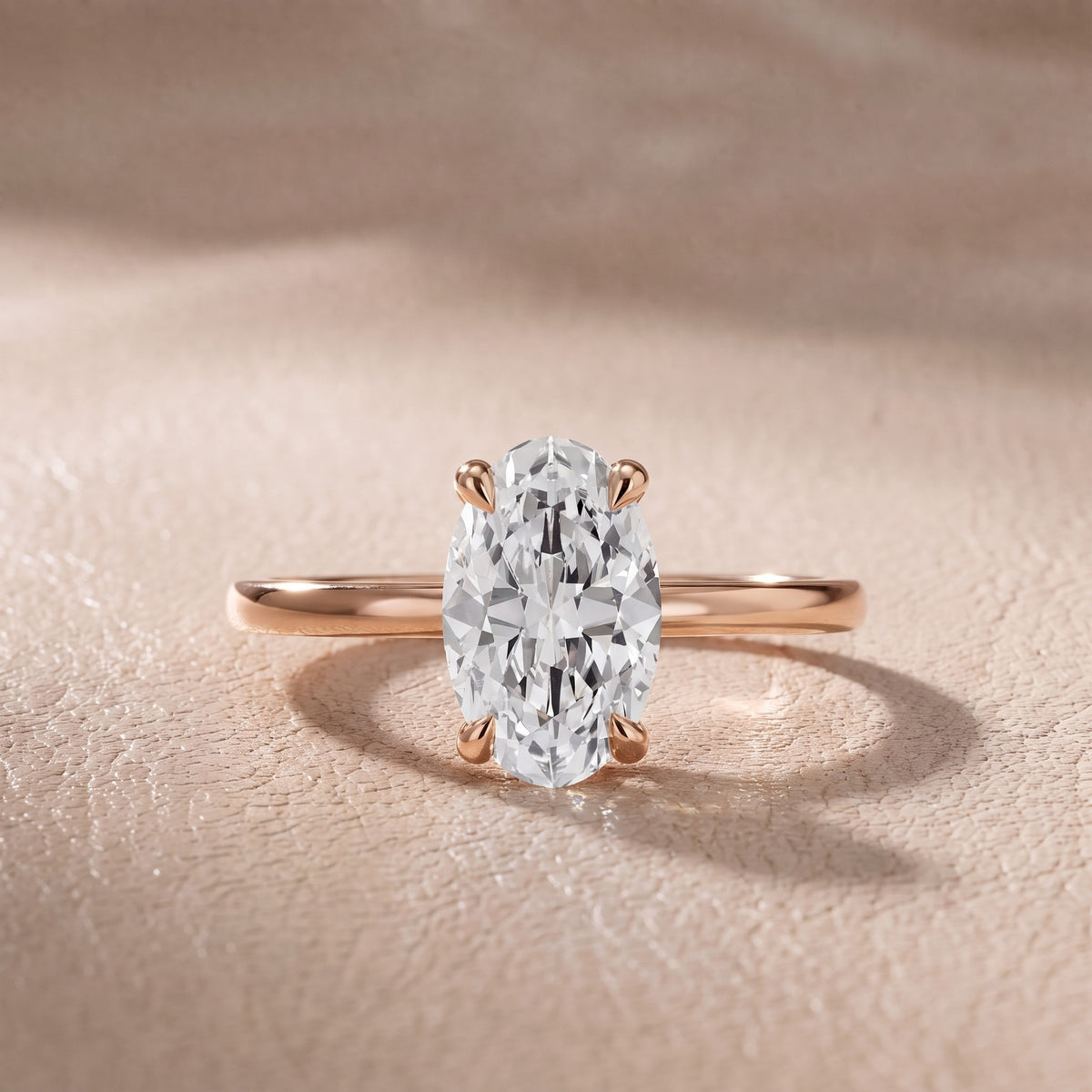 Nella Petite Solitaire Oval Diamond Engagement Ring in Rose Gold - front.jpg
