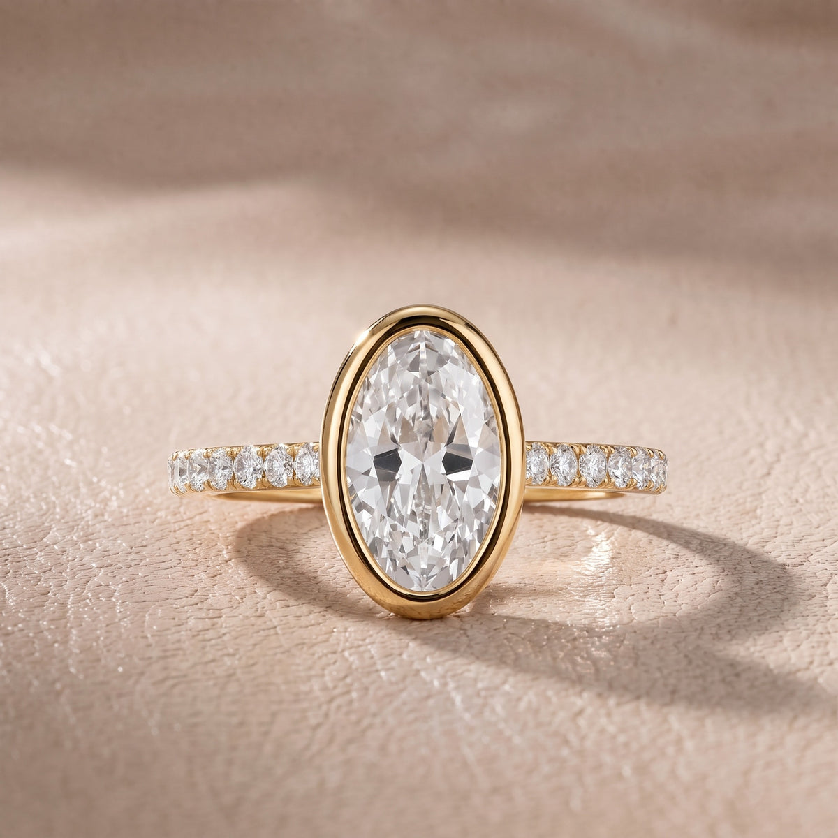 Cora Bezel Pavé Oval Diamond Engagement Ring in Yellow Gold - front.jpg