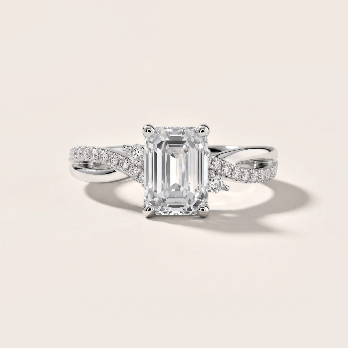 Reno Pear-Side Twist Emerald Diamond Engagement Ring in Platinum - front.jpg