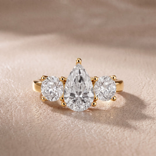 Callie Three-Stone Trellis Pear Diamond Engagement Ring in Yellow Gold - front.jpg