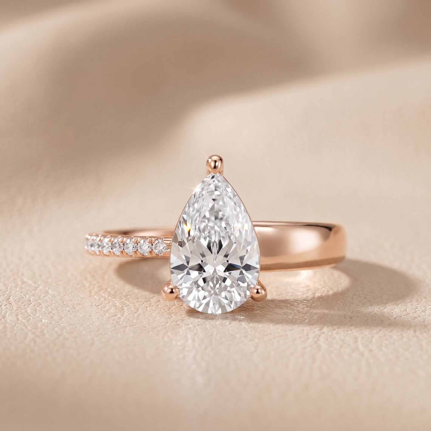 Rosie Solitaire Basket Pear Diamond Engagement Ring in Rose Gold - front.jpg