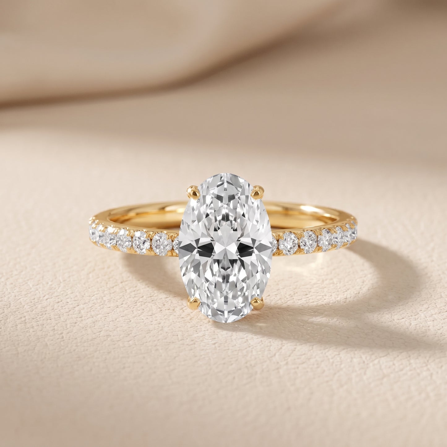 Juna French Pavé Solitaire Oval Diamond Engagement Ring in Yellow Gold - front.jpg
