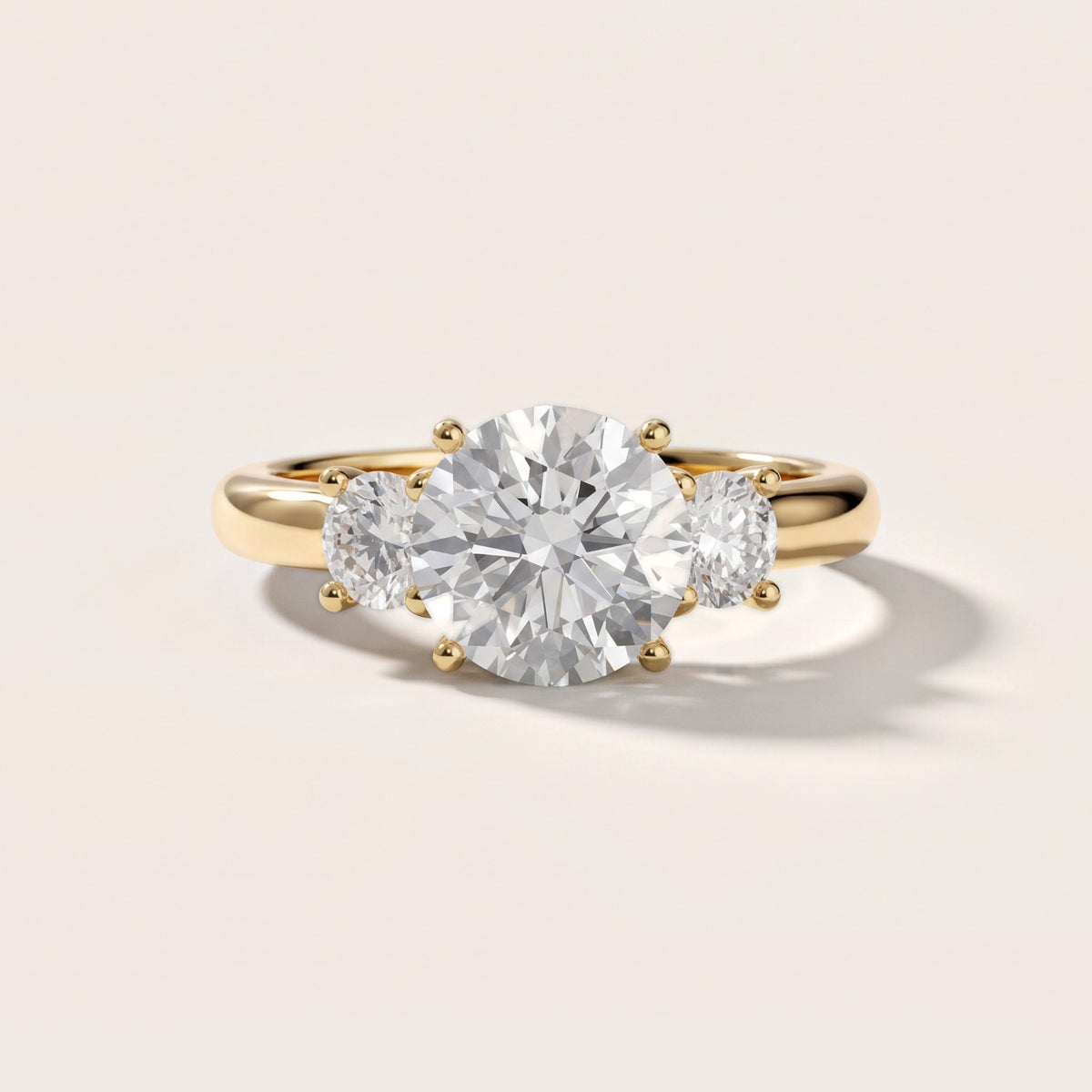 Zara Three-Stone Round Diamond Engagement Ring in Yellow Gold - front.jpg