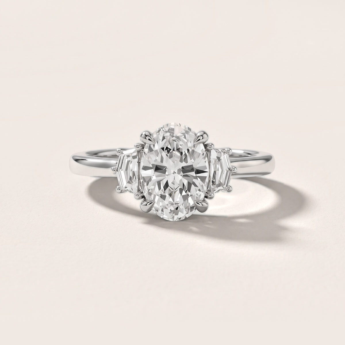 Elmira Step-Cut Three-Stone Oval Diamond Engagement Ring in Platinum - front.jpg
