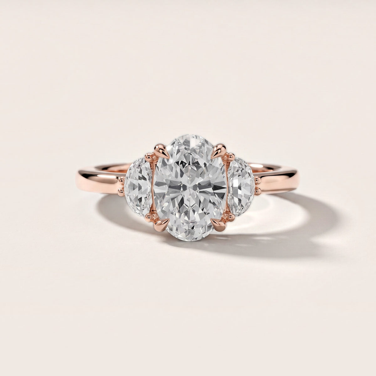 Madera Half-Moon Three-Stone Oval Diamond Engagement Ring in Rose Gold - front.jpg