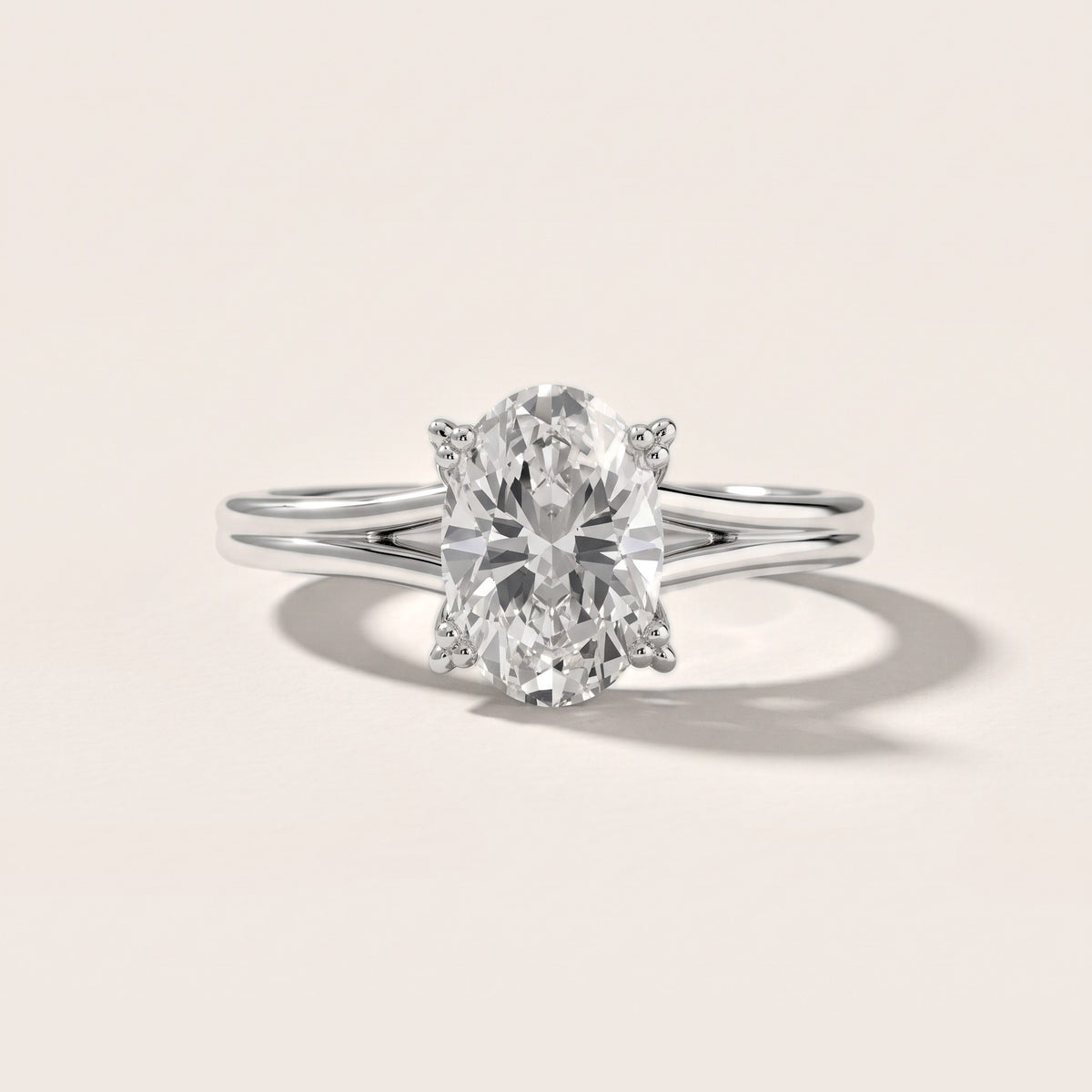 Neve Solitaire Split Shank Oval Diamond Engagement Ring in White Gold - front.jpg