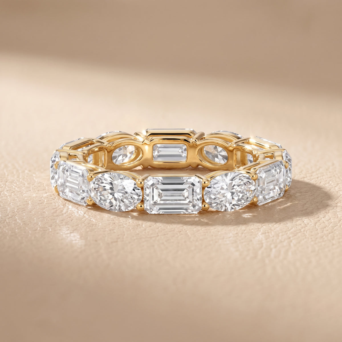 Avery Shared Prong Emerald & Oval Diamond Eternity Band in Yellow Gold - front.jpg