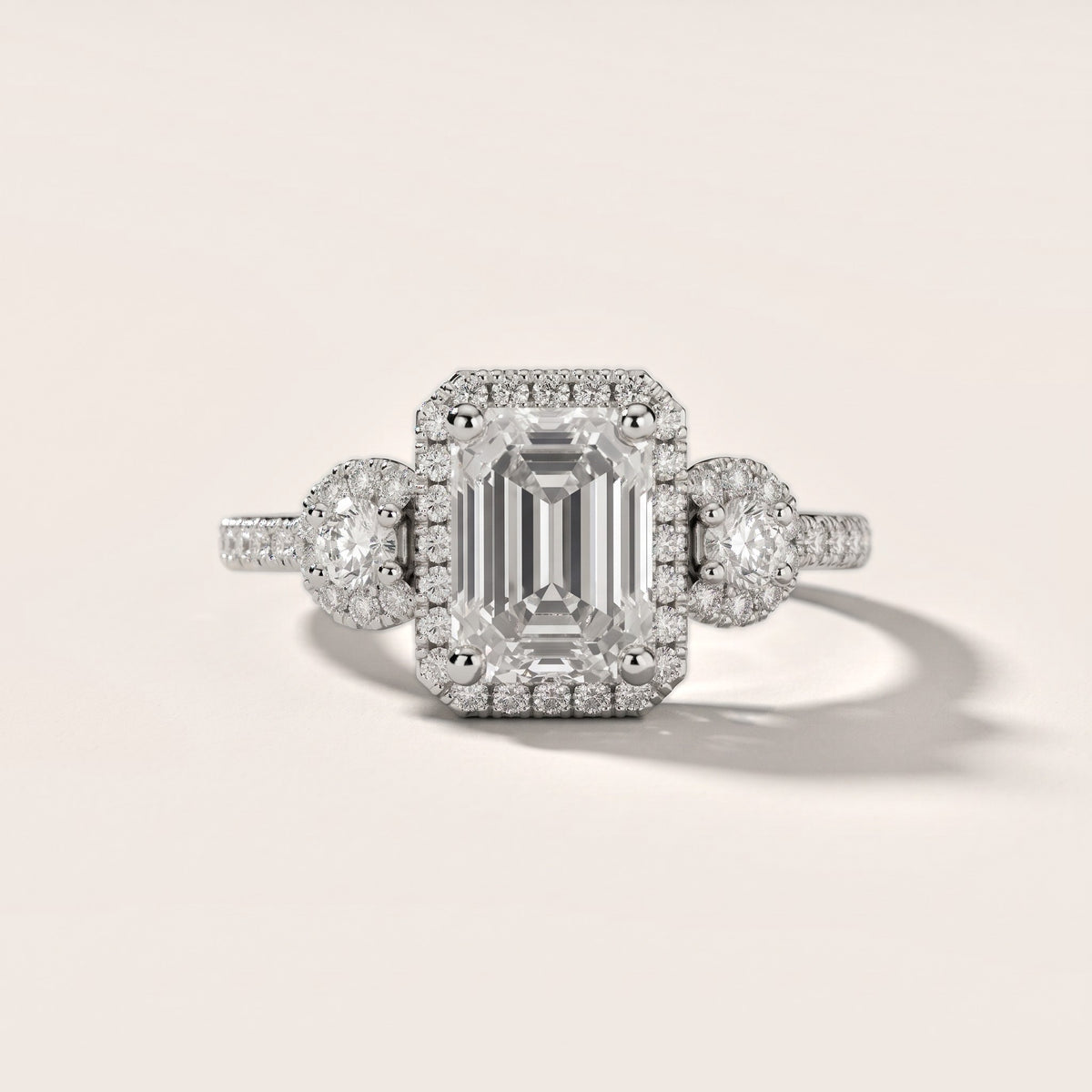 Denver Three-Stone Halo Emerald Diamond Engagement Ring in Silver - front.jpg