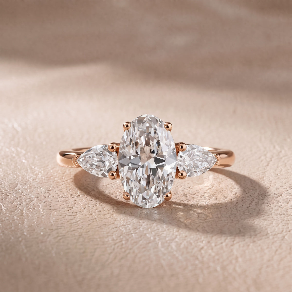 Sophia Three-Stone Oval Diamond Engagement Ring in Rose Gold - front.jpg