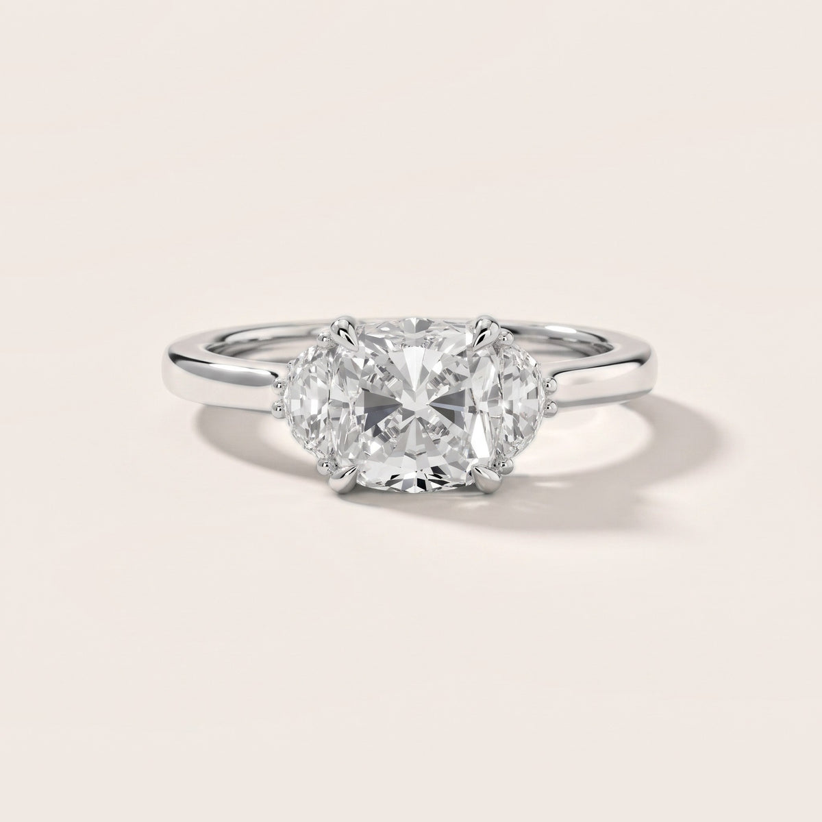 Geneva Half-Moon Three-Stone Cushion Diamond Engagement Ring in Platinum - front.jpg